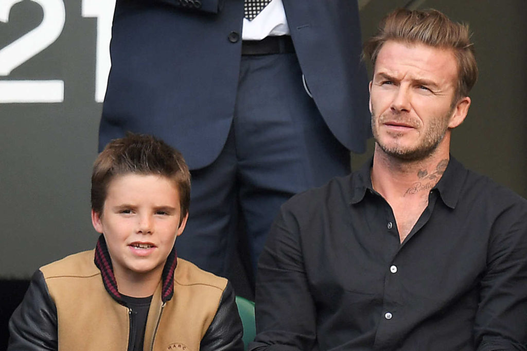 Cruz Beckham ao lado de seu pai, David