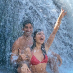 Isis Valverde e André Resende em cachoeira