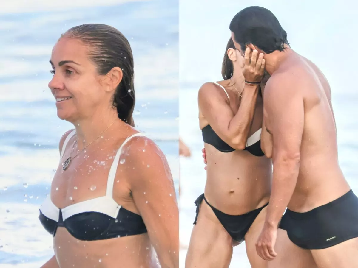 Ana Paula Guimarães curte praia com o marido, o ator Ricardo Duque